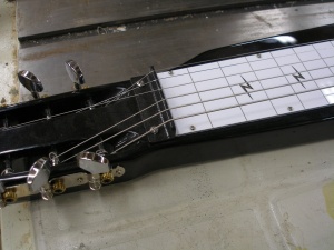 Angle iron nut on a modified lap steel